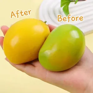 Detail of color-changing mango squeeze toy showing before and after color transition