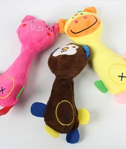 Macro view of cartoon plush dog toys featuring colorful monkey, pig, and giraffe characters