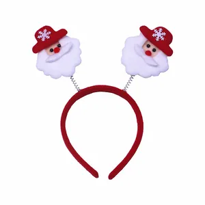 Rode kerst hoofdband met verende kerstman figuurtjes voor een feestelijke vakantie.