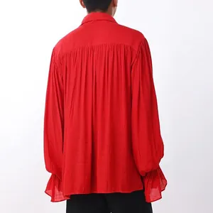 Detailed back view of a red medieval men's vintage costume shirt with gathered pleats