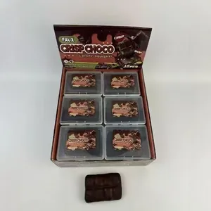 Box of 12 realistic chocolate bar squishy toys for stress relief and sensory fun.