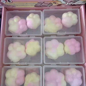 Detailed view of 12pcs cute cat paw stress relief squeeze toys in individual clear cases