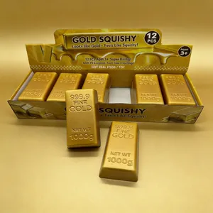 Detailed view of 12-piece gold bar squishy toys in a display box for stress relief.