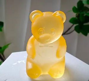 Close-up of a translucent yellow gummy bear squishy toy with a soft jelly-like texture