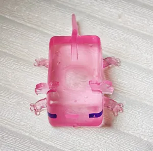 Close-up view of a pink translucent axolotl-shaped squishy stress relief toy