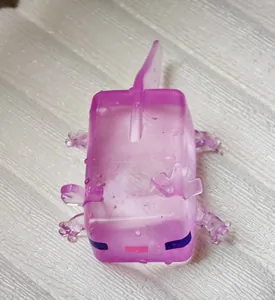 Detail view of a purple axolotl squishy toy featuring a translucent ice cube texture
