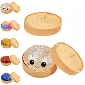 Set of glitter dumpling squishy toys in steamer baskets with various vibrant colors