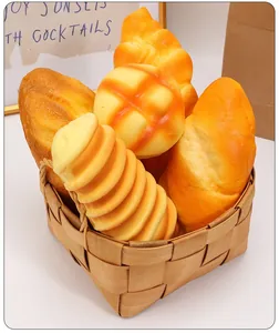 Assortment of realistic PU slow rebound bread squishy toys in a woven basket