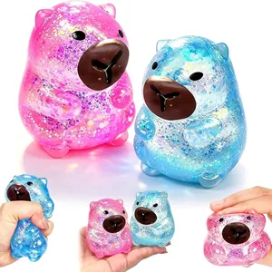 Rosa und blau glitzerndes Wasserschwein-Quetschspielzeug zum Stressabbau und Spaß