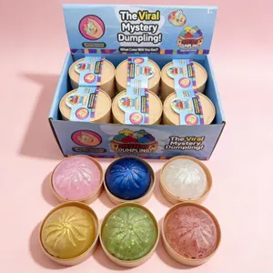 Bunte Glitzer-Überraschungs-Dumpling-Squishy-Spielzeuge in einer Verkaufsbox.