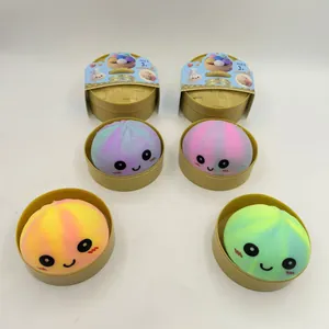 Set of colorful smiling face bun squishy toys with individual plastic steamer cases