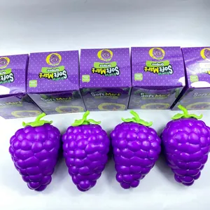 Macro detail of giant purple grape squishy toy and its original Soft Mart packaging
