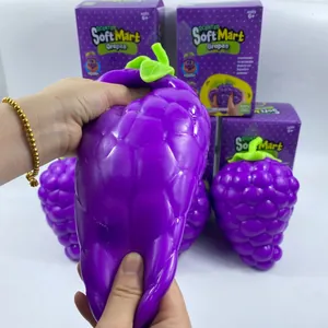 Close-up of jumbo purple grape squishy toy being squeezed to show texture