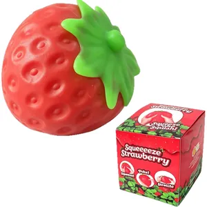 Juguete antiestrés gigante con forma de fresa roja con su caja de regalo colorida