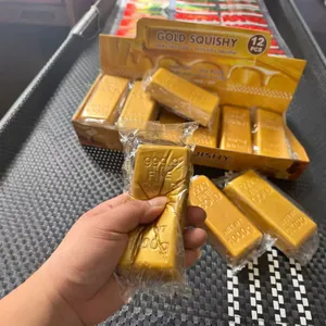 Gold bar squishy toy detail showing soft slow-rebound texture and retail packaging