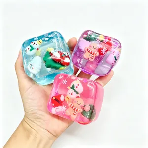 Close-up of colorful Christmas themed stress relief squishy cubes with snowman and tree