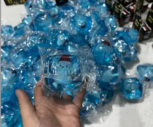 Close-up macro view of blue translucent Christmas snowman ice cube maltose squishy toy