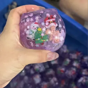 Christmas themed maltose squishy cube toy with snowman and Santa figures.