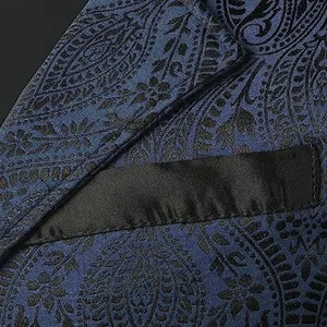Close-up of blue paisley pattern fabric and black pocket detail on Gothic vest