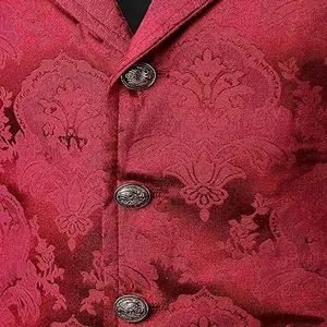 Close-up of red jacquard fabric and ornate metallic buttons on a medieval gothic vest