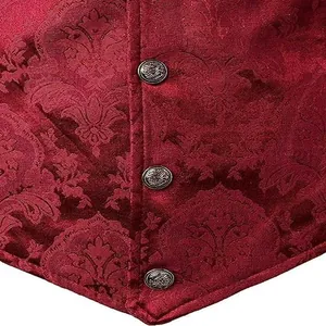 Macro view of red damask jacquard fabric and ornate metal buttons on gothic vest
