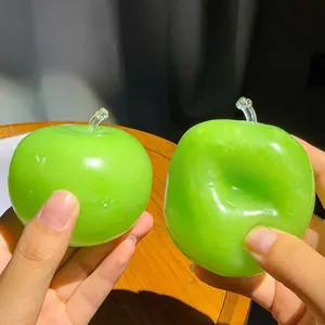 Detail view showing the soft and malleable texture of green apple stress relief squishy toy