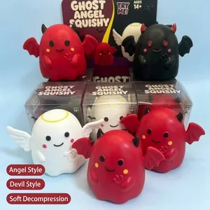 Close-up macro view of ghost and demon squishy toys with angel and devil themes