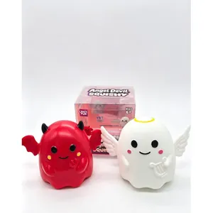 Close-up of red devil and white angel Halloween ghost squishy toys with packaging box