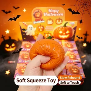 Halloween pumpkin squishy toy being squeezed to show soft, slow-rebound texture.