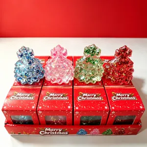 Set of 4 glitter Christmas tree squishy toys in festive red packaging for stress relief