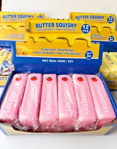 Close-up detail of pink strawberry butter squishy slow rising toys in a retail display box