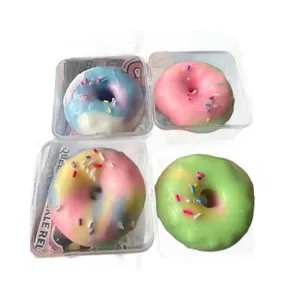 Set of 4 colorful donut-shaped stress relief squeeze toys in clear plastic boxes