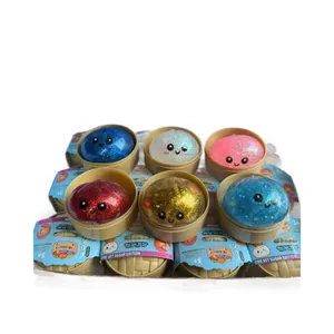 Juguetes antiestrés squishy baozi con purpurina de colores en mini cestas de vapor