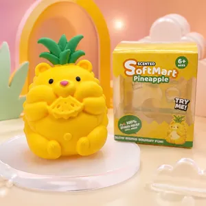 Detailed shot of yellow pineapple bear squishy stress relief toy with packaging