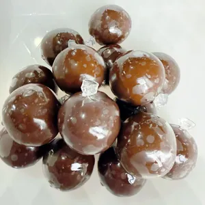 Macro detail of glossy brown handmade squishy balls designed for stress relief and fun play