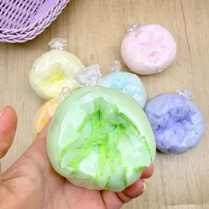 Close-up detail of colorful gradient crispy skin stress relief squishy balls in hand