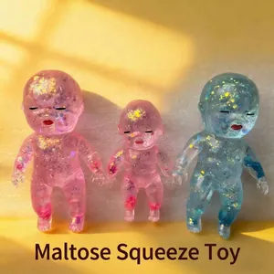 Set of three glittery maltose crystal baby doll squishy toys in pink and blue colors