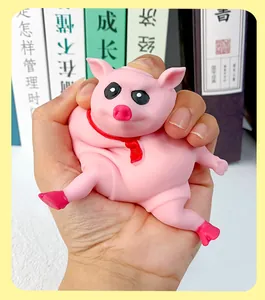 Close-up detail showing the soft squishy texture of a pink pig stress relief toy