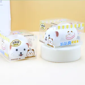 Detailed view of white puppy squishy stress relief toys in cute retail gift boxes
