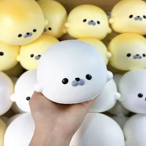Cute white and yellow seal-shaped squishy toys featuring soft slow rebound decompression feel