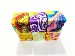 Close-up detail of vibrant marbled patterns on slow-rebound squishy decompression cubes
