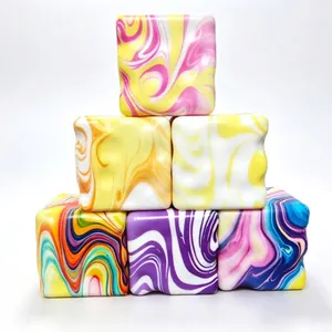 Vibrant colorful marbled squishy cubes for stress relief made of slow rebound PU foam