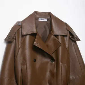 Elegant brown faux leather short trench coat jacket for women with double-breasted detail