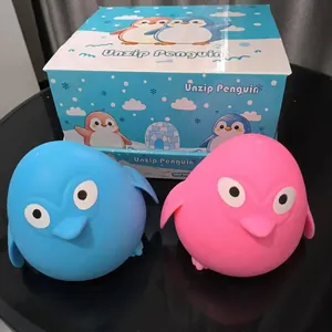 Detailed view of blue and pink slow rebound penguin squishy toys with original packaging box.