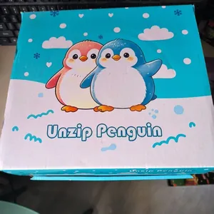 Close-up of retail packaging for a cute penguin themed squishy stress relief toy