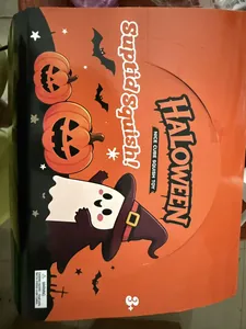Detailed view of Halloween packaging featuring cartoon ghost and pumpkin squishy cube toy box.