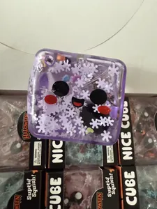 Detailed macro shot of a purple Halloween squishy cube with festive snowflake fillings