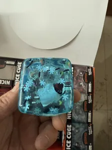 Detailed macro view of a blue translucent Halloween squishy toy with snowflake patterns.