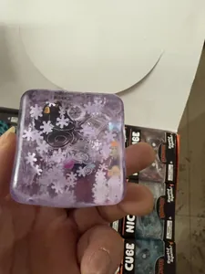 Handheld purple translucent Halloween squishy cube with snowflakes and ghost patterns