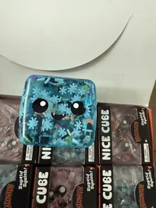 Close-up of blue translucent Halloween squishy cube toy with snowflake patterns details